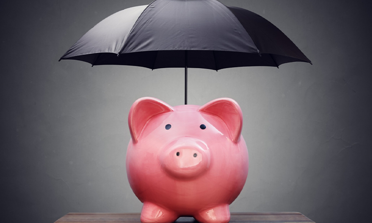 piggy bank with umbrella above