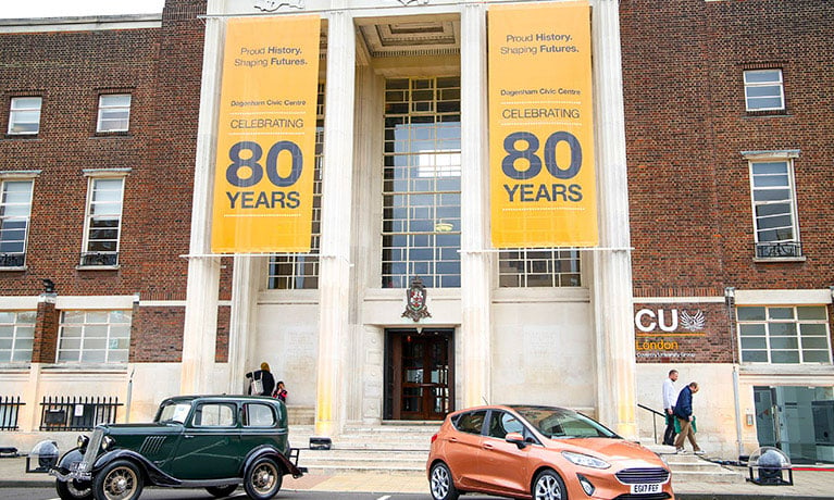 80th celebration banners on CU London building