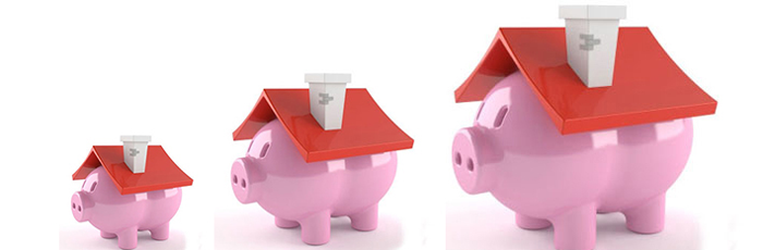 Three piggy bank houses in a row