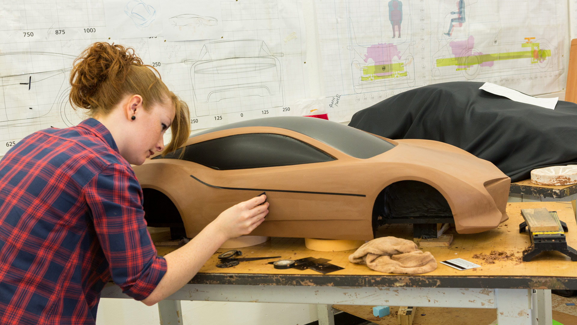 A student working on creating a model of a vehicle