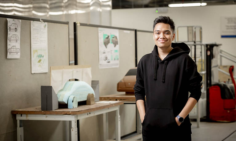 apprentice smiling standing in a design studio