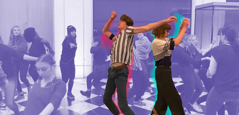 Two people dance in the foreground while the rest of the image is behind a purple filter.