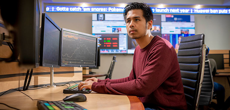 Student at a computer on the trading floor