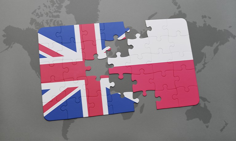 english and polish flags split apart like a jigsaw puzzle