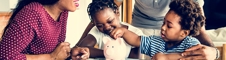 A family saving money with a piggy bank