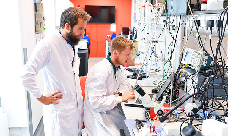 Dr Jason Tallis with a postgraduate researcher