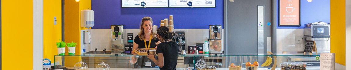 A student buying a drink from the Union Streat Kitchen