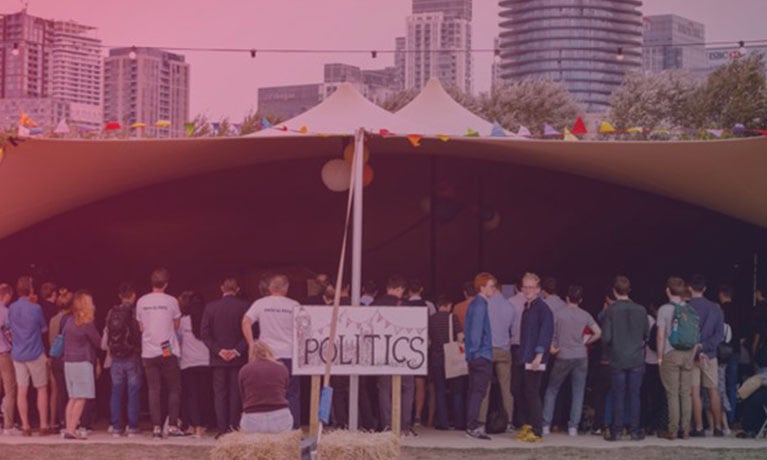A crowd in a 'politics' tent