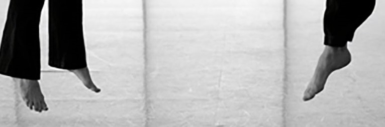 dancers feet in mid flight off the ground