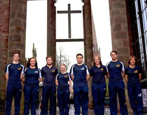 Coventry sports therapy students stood on the cathedral stairs
