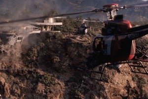 Screenshot from Iron Man 3 film of two helicopters attacking Iron Man's Malibu Mansion