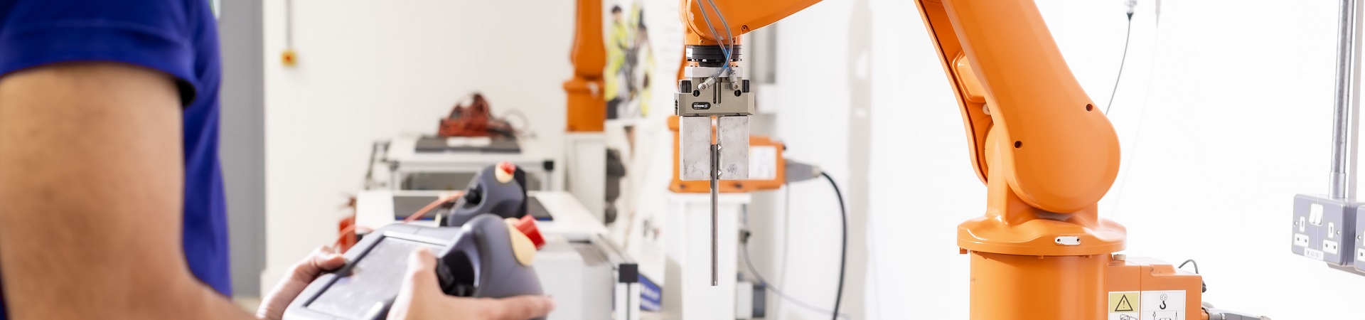 Student Analysing tools in a factory workshop