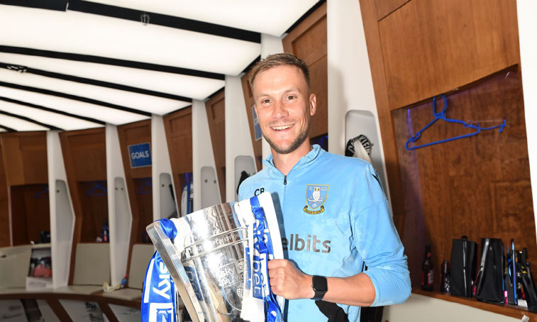 Chris Brealey holding EFL League One play-off final cup