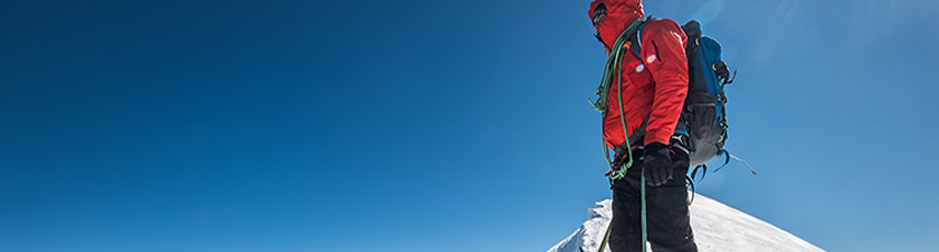 Man stood on top of a mountain