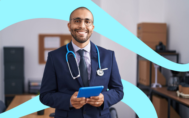 Smiling health professional in a suit with a stethoscope, holding a tablet in a modern office setting.