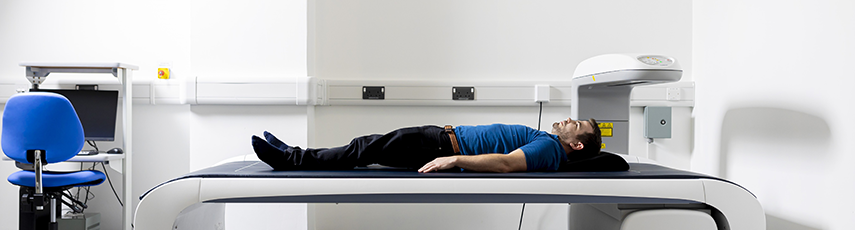 Person lying on top of a machine