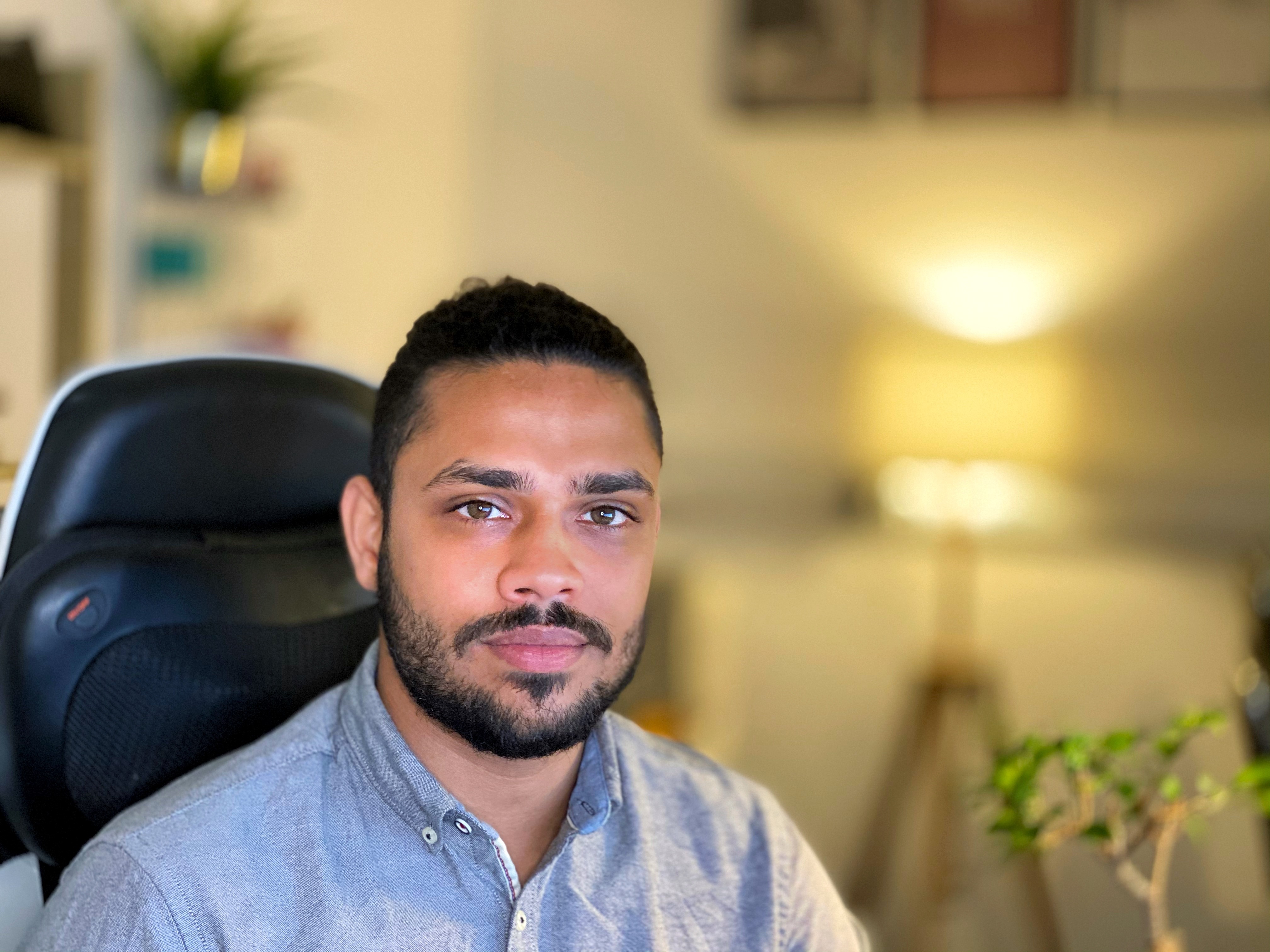 Hyder Khan sitting at a desk