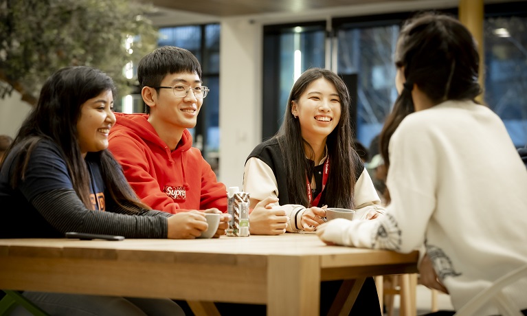 Students sitting around a table at Coventry University