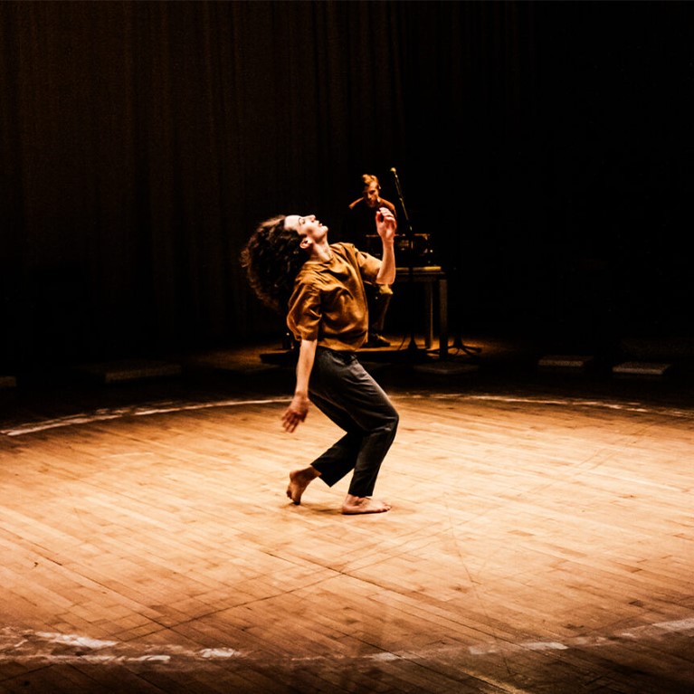 Florinda Camilleri dancing on a wooden floor
