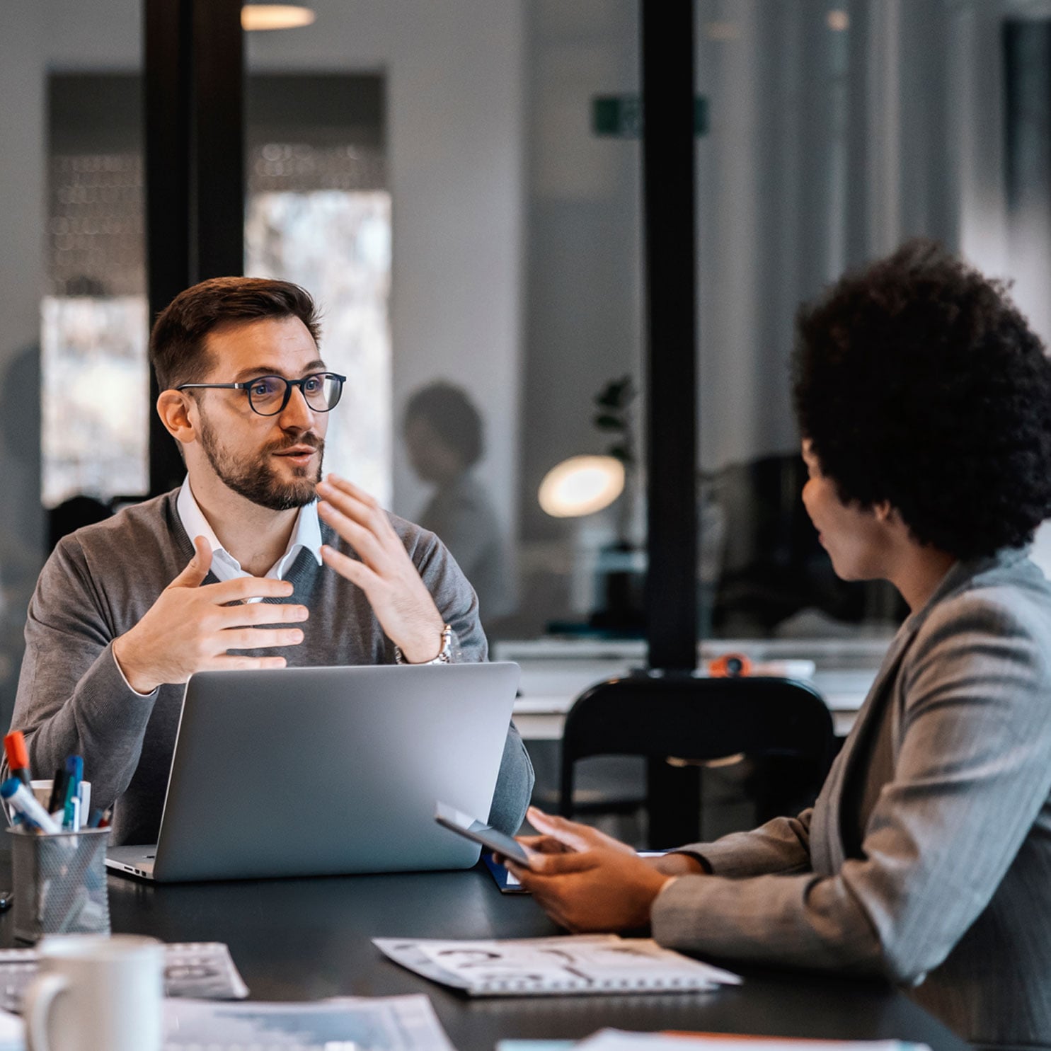 picture of business professionals discussing improvements in office