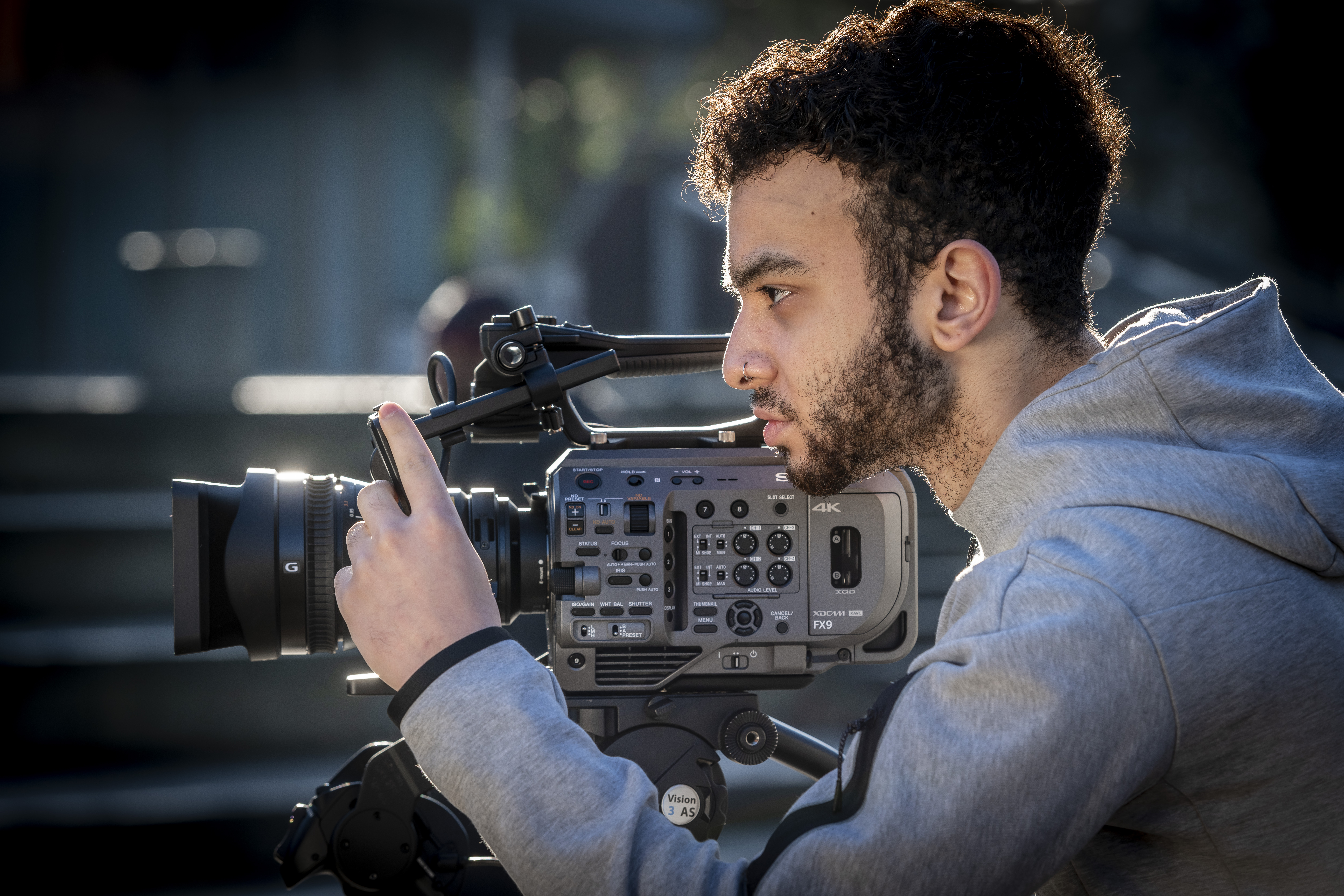 a man filming with a camera a man filming with a camera