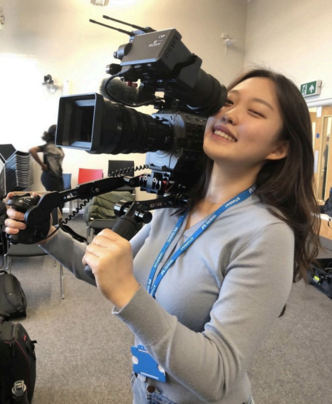 Juyoung Kim holding a Film Camera Juyoung Kim holding a Film Camera