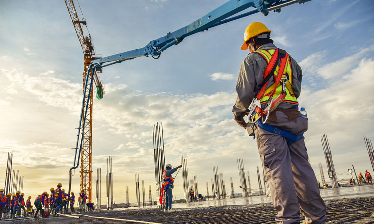 Construction manager with hardhats onsite