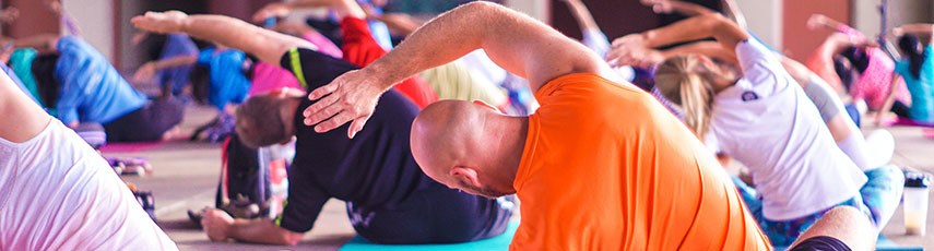 people sitting on the floor doing yoga 