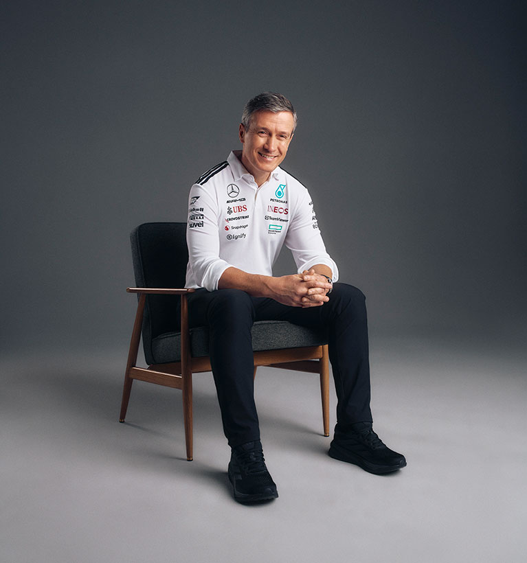 Rob Thomas sat in a chair in a photo studio