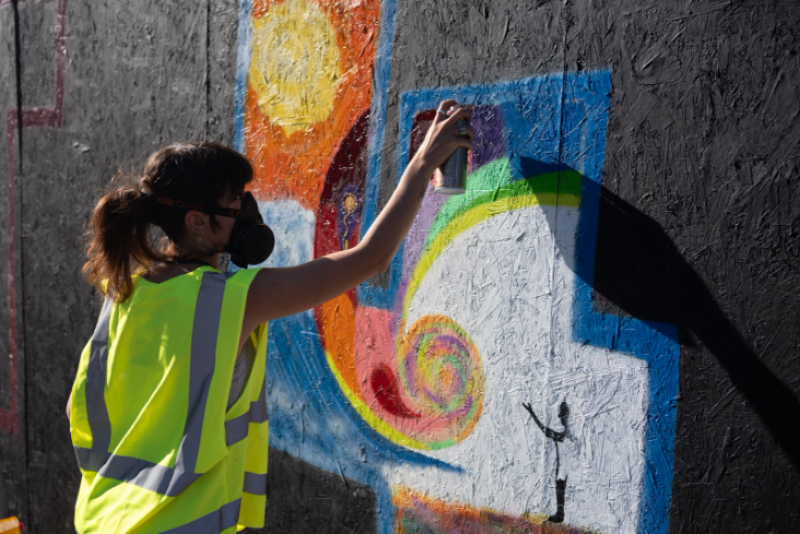 Art-street-strategy Person painting on a wall