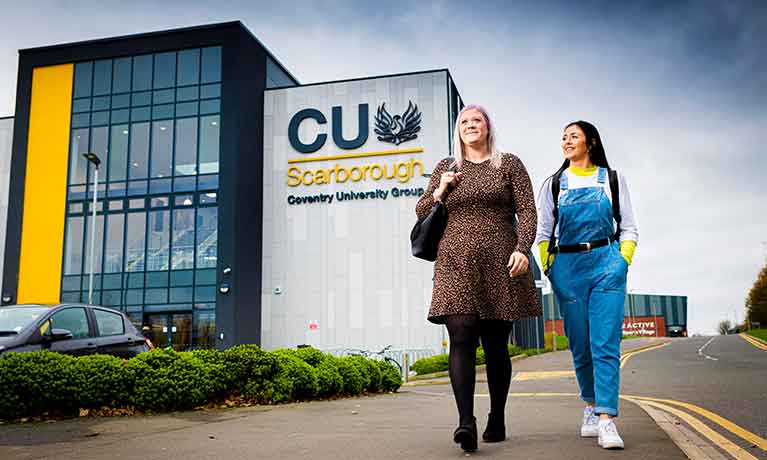 Two students outside Scarborough building