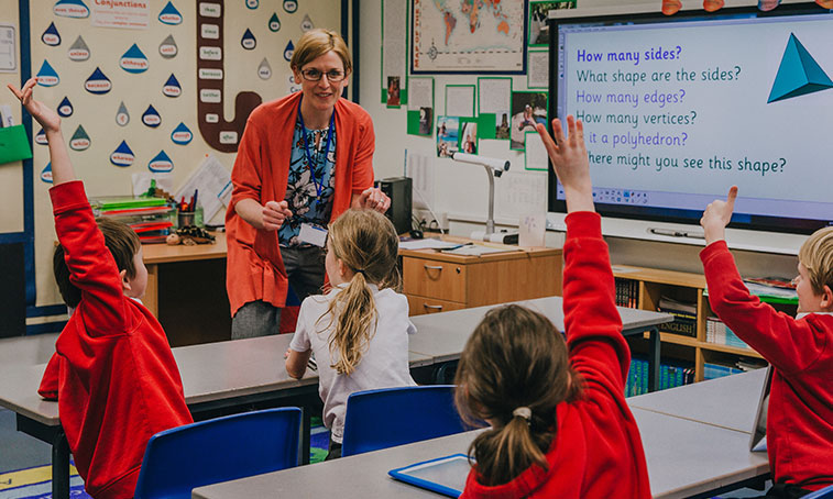 A teacher in a primary classroom