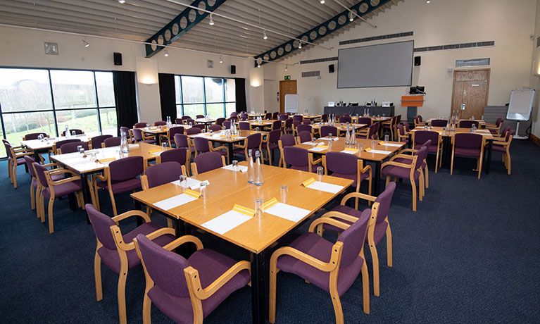 room made up with tables and chairs