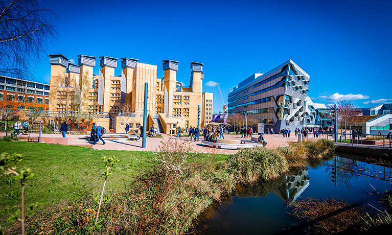 Wide view of Coventry University library and engineering building on a summers day