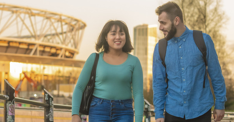 Two students walking through East London.