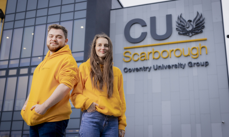 Three students at coventry univeristy looking happy and have smile 