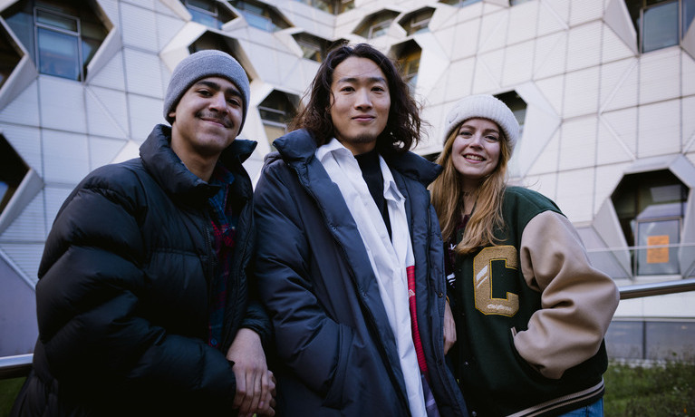 A group of students laughing and talking