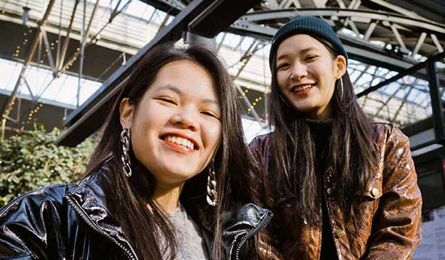 Two female students smiling