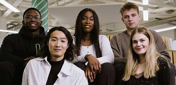 Group of students sitting in the Student Hub