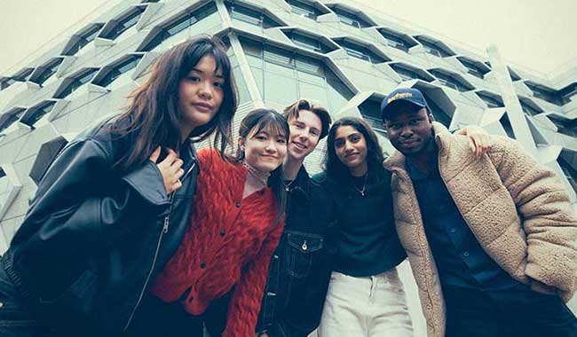 Group of students standing outside the EEC building 