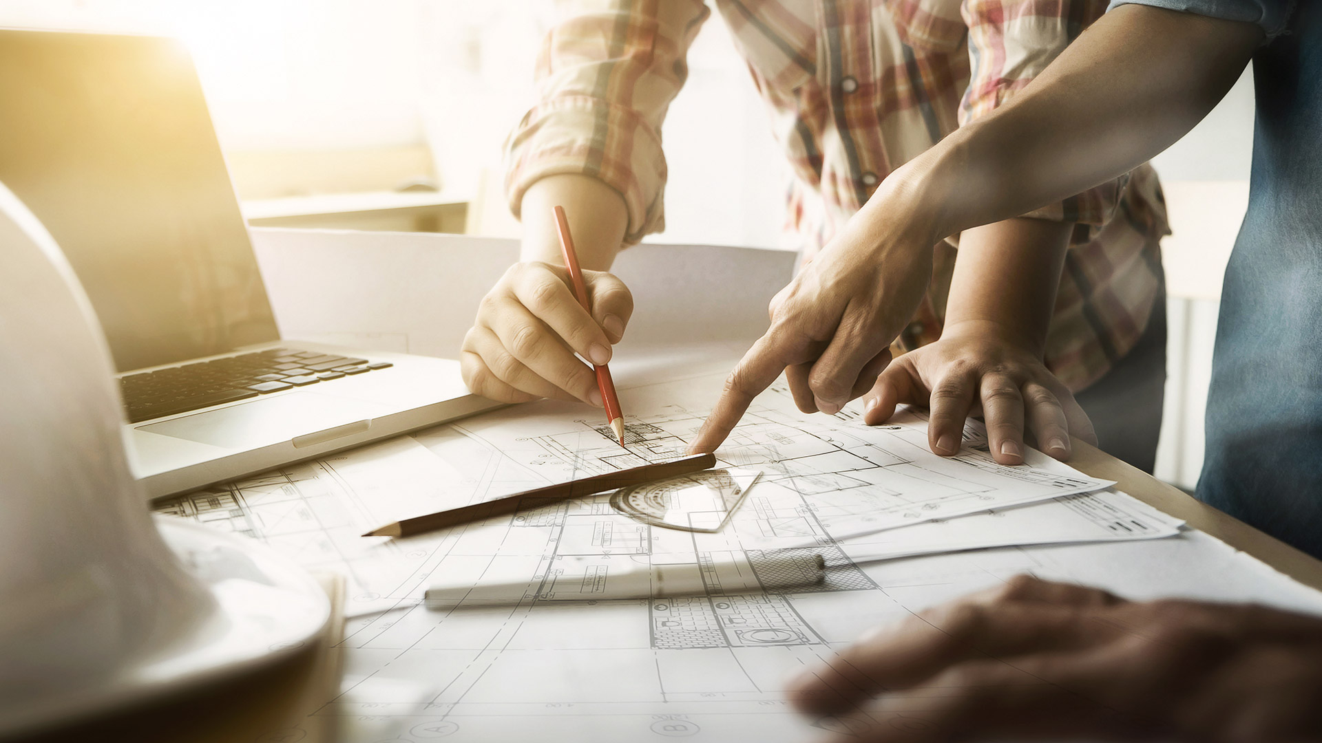Architects planning on a sheet of paper