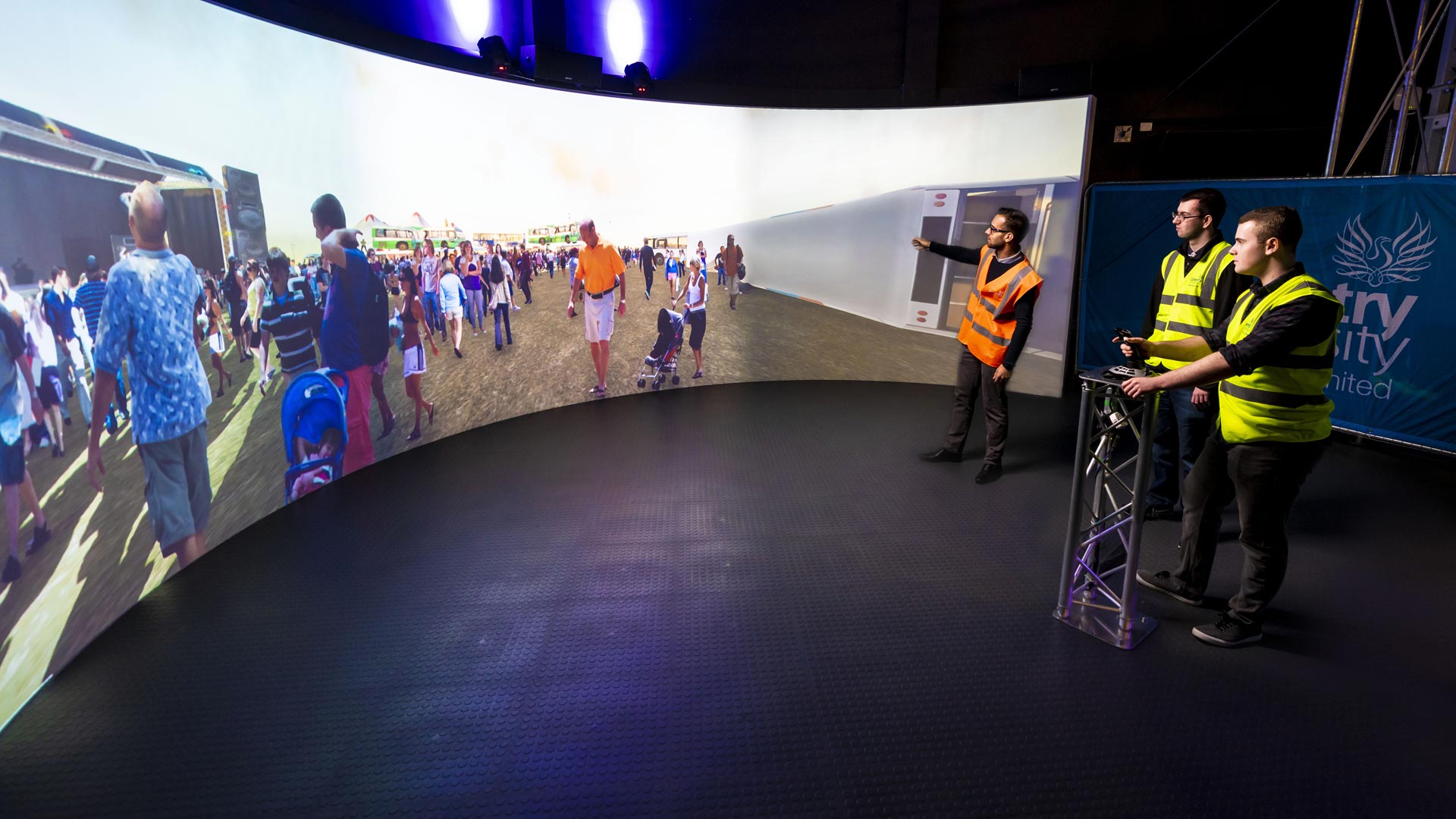 Students using the interactive screen in the simulation centre