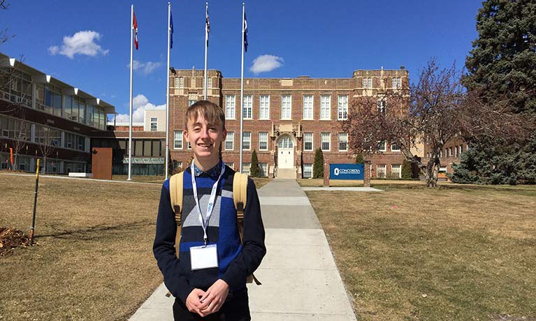 Student Connor Riddlesden standing in front of an university 