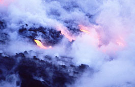 Close up of an erupting volcano with molten lava and smoke