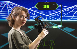 Female student with virtual reality headset against a virtual digital screen