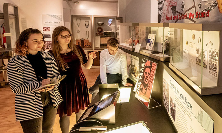 Students looking at a museum exhibit