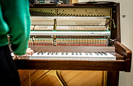 Students playing a keyboard