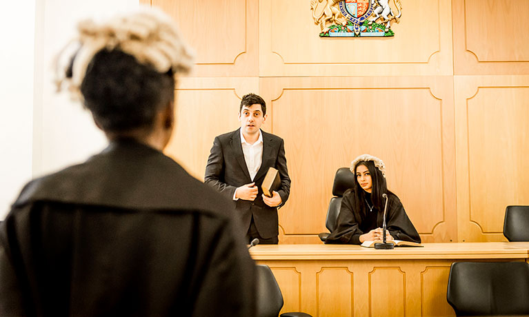 Students practicing in the mock courtroom