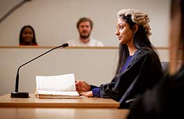 side view female judge sitting in moot room