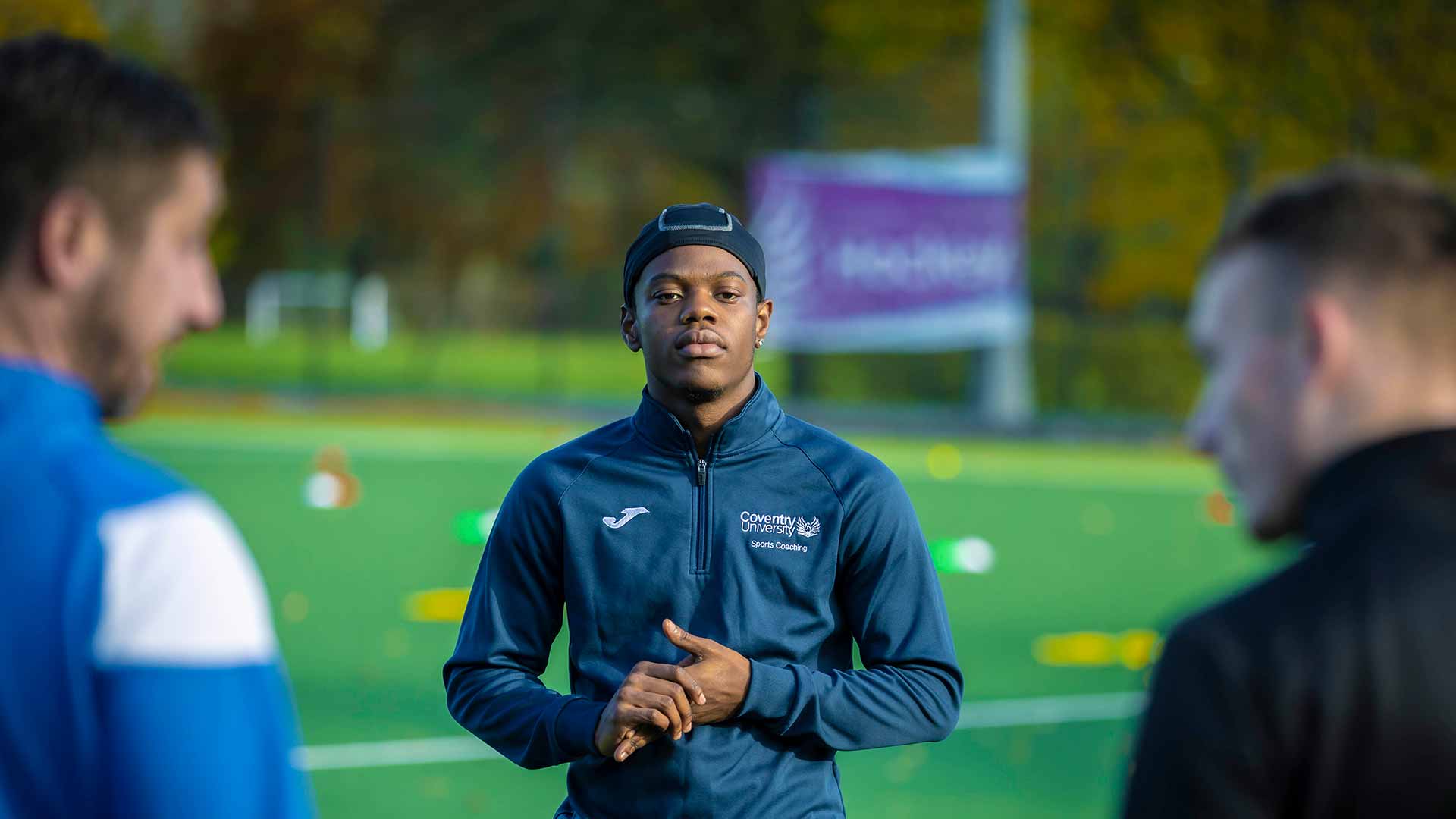 Students on a football pitch training